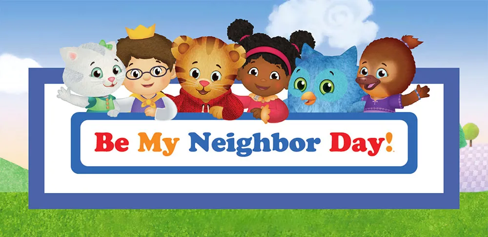 Daniel Tiger and friends from Daniel Tiger's Neighborhood, a kitten, a boy in a crown, a girl, an owl and a platypus, peek over a sign reading Be My Neighbor Day! on a green lawn under a blue sky.